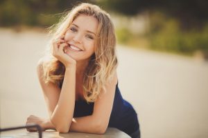 Young smiling woman outdoors portrait