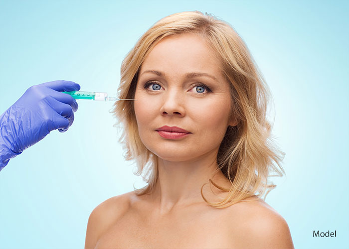 Woman getting filler injectable