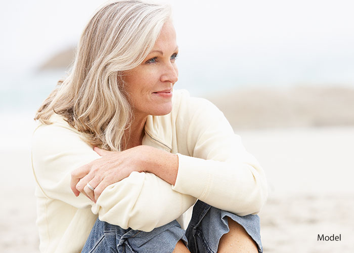 Woman sitting at the beach