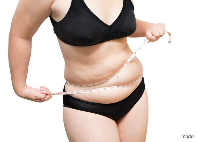 Woman holding tape measure