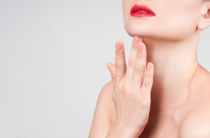 Beautiful woman neck with clean skin and red lips