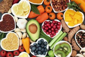 Health food for fitness concept with fruit, vegetables, pulses, herbs, spices, nuts, grains and pulses. High in anthocyanins, antioxidants, smart carbohydrates, omega 3, minerals and vitamins-img-blog